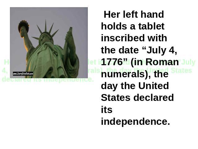 Her left hand holds a tablet inscribed with the date “July 4, 1776” (in Roman numerals), the day the United States declared its independence.