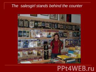The salesgirl stands behind the counter