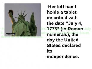 Her left hand holds a tablet inscribed with the date “July 4, 1776” (in Roman nu